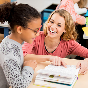 teacher helping schoolgirl at WGA